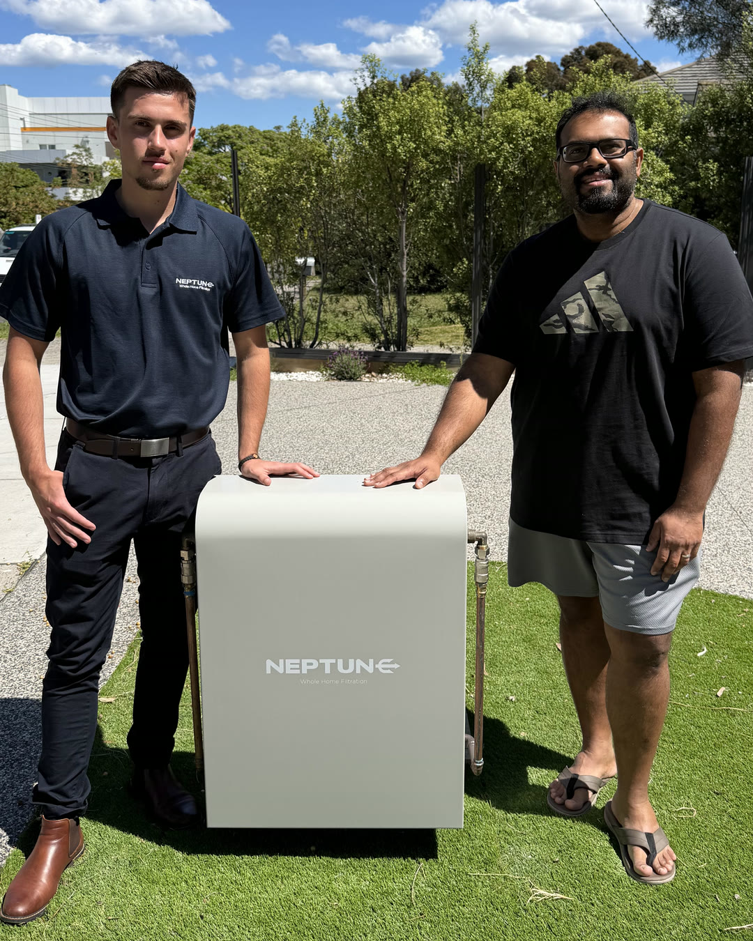 Stefan from Neptune Filtration with customer Girish at his installed system